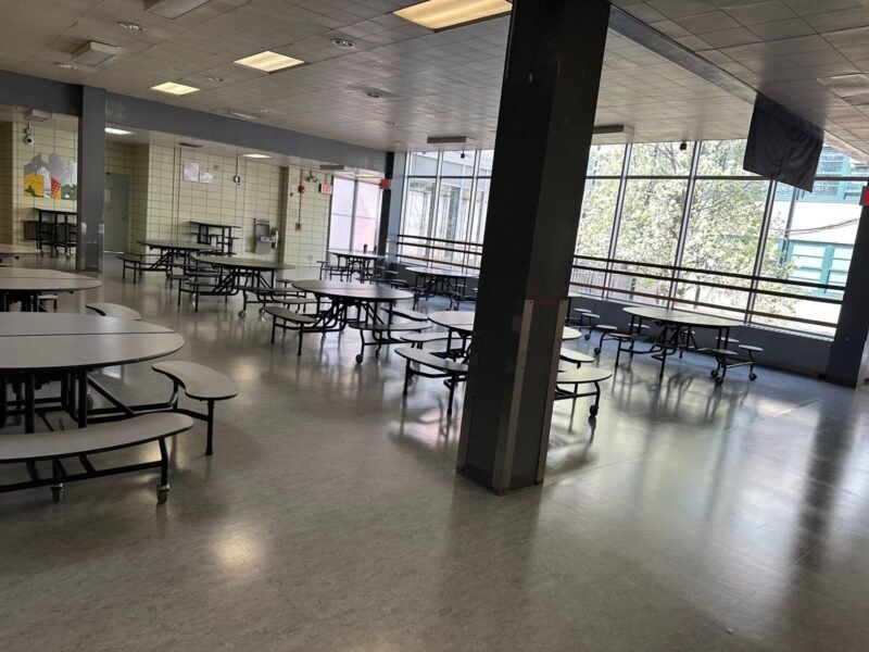 Cafeteria seating area along a window wall